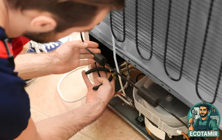 متخصص در حال تعمیر یخچال ویرپول